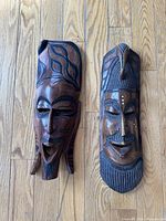 Front view of both carved wooden masks