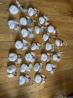 All 23 angel ornaments laid out on floor