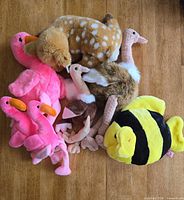 Group shot of all seven Ty Beanie Babies plush toys on floor