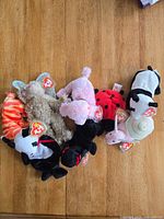 Group overview of all seven Beanie Babies on tabletop