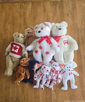 Group shot of all seven Ty Canadian-theme bears on tabletop