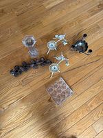 All six candle holders laid out on floor