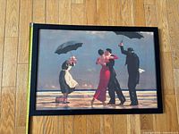 Front view of framed print with tape measure showing width and height