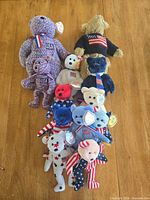 All 12 patriotic Ty bears laid out on table