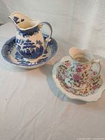 Overall view of both pitcher and basin sets