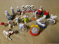 Group shot of all Dalmatian figurines on table