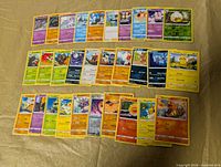 All 30 Pokémon cards laid out in three rows