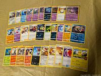 Full spread of 30 Pokémon cards in three rows