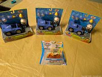 Three sealed CKN Toys Pilot Hero Racer sets and one sealed Paw Patrol Rocky vehicle displayed on table