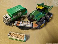 All four toy vehicles arranged on surface
