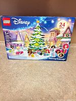 Front of sealed LEGO Disney Advent Calendar box showing artwork and contents