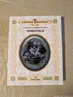 Front of Lejendary Adventure Essentials box showing title, artwork, author