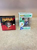 Front view of both boxed figures