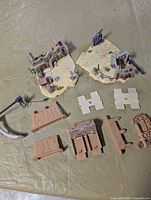 Overview of all desert-themed playset pieces laid out on table