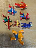 All seven action figures laid out