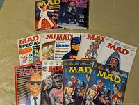 Group shot showing two yearbooks and seven magazines