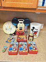 All items overview: tins, clock, wastebasket, keychain