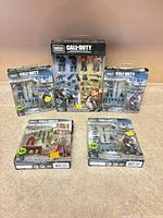 All five sealed Mega Construx Call of Duty sets standing and lying for group view