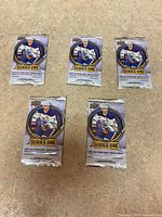 Front view of five Upper Deck Series One 2025-26 sealed packs