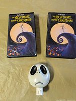 Front view of two VHS tapes and night light