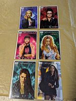 Six bagged Orphan Black comics laid out showing all covers