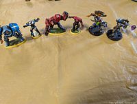 Front view of all six miniatures lined up