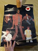 Stack of identical Michael Jackson posters showing full design