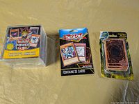Group shot of three sealed Yu-Gi-Oh! card products
