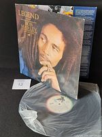 Front gatefold cover with record partially visible