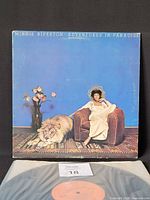 Front album jacket and partial view of record