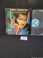 Front cover of Chuck Berry Hail! Hail! Rock ’N’ Roll LP with vinyl partially visible
