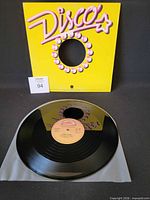 Front view showing yellow Disco sleeve and record