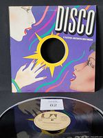 Front view of record in United Artists DISCO sleeve alongside vinyl