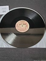 Record front side displaying centre label and vinyl surface