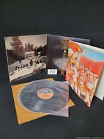 Gatefold jacket open showing inner artwork, vinyl in sleeve