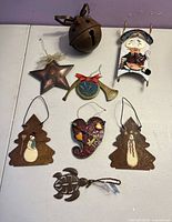 all eight metal ornaments laid out