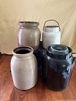 Group shot of four stoneware crocks in assorted colors