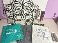 Group shot of wine rack, electric opener, waiter corkscrew, three wine totes