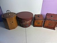 Group shot of wooden ice bucket, round Christmas box and two wooden canisters