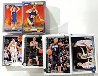 Stacked cards showing Paolo Banchero, Egor Demin, Julian Strawther and Grizzlies insert