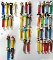 All 39 PEZ dispensers arranged on surface