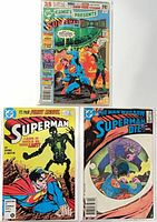 Front covers of the three comic books in plastic sleeves