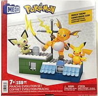 Front of sealed Mega Pokémon Pikachu Evolution Set box showing Pichu, Pikachu, Raichu builds and rooftop scene