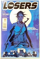 Front cover of The Losers #15 showing artwork and overall condition