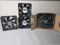 Three case fans and Ryzen 7 2700 box with Wraith Spire cooler