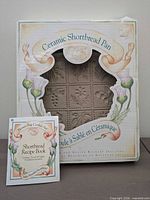 front of boxed Brown Bag ceramic shortbread pan with recipe booklet