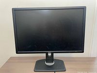 Front view of Dell U2412M monitor on stand