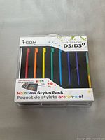Front of sealed i-CON Nintendo DS/DSi Rainbow Stylus Pack showing seven coloured styluses