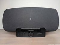 Front view of speaker with control dock visible