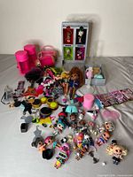 Full collection overview with dolls, accessories, display, storage cases visible